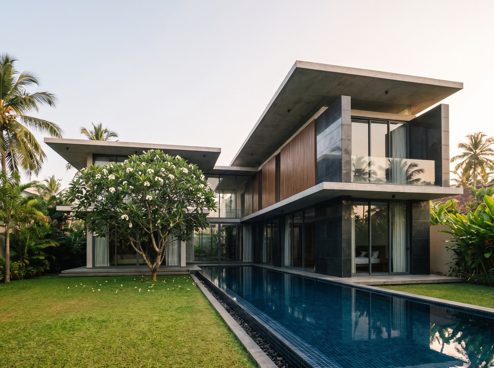 Completed luxury house with deep roof overhangs and a garden in Sri Lanka