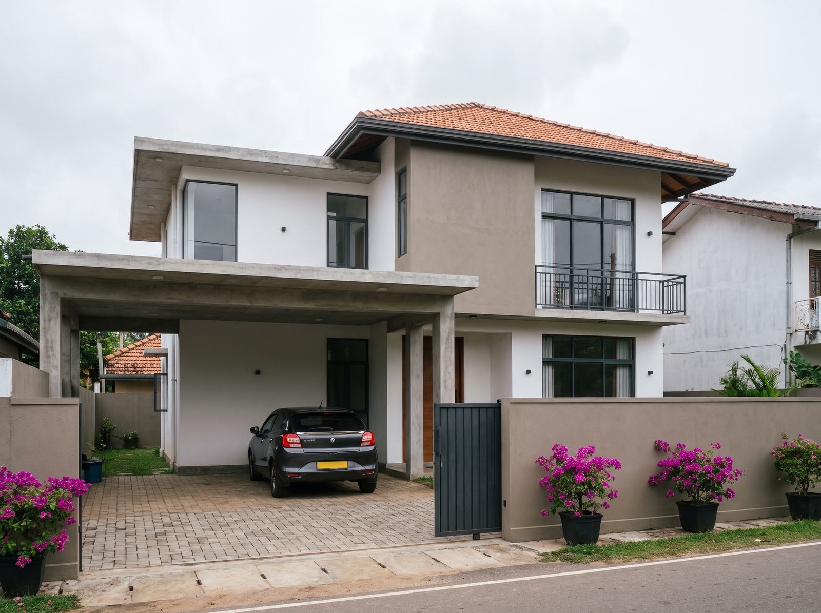 Two-storey semi-luxury family house with a car porch in a Sri Lankan suburb